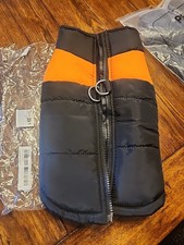 Small to medium dog coat or jacket, Size Says Large. New in package.  picture