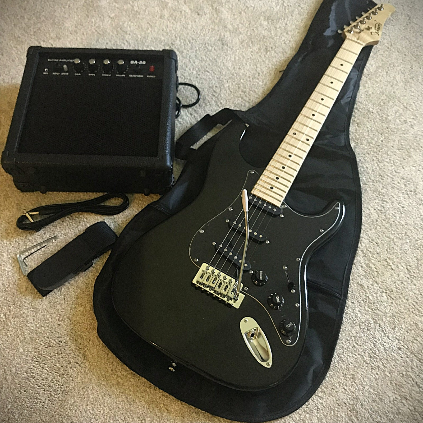 Full-Size Black Electric Guitar Starter Package with 20-Watt Amp and Accessories Full-Size Black Electric Guitar Starter Package with 20-Watt Amp and Accessories